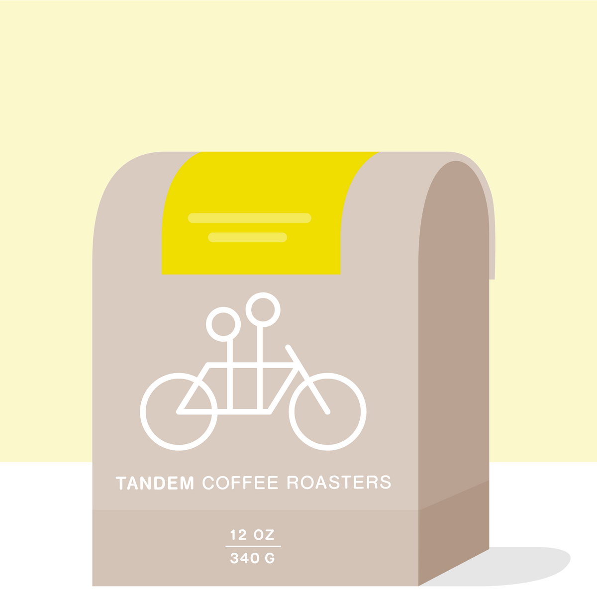 A beige coffee bag labeled Tandem Coffee Roasters features a white tandem bicycle graphic, yellow accent, and text showing 12 oz (340 g). Highlighting their Alejandrina Maytan - Peru offering, this bag evokes the rich flavors of the Inkawasi Valley. The background is light yellow and white.