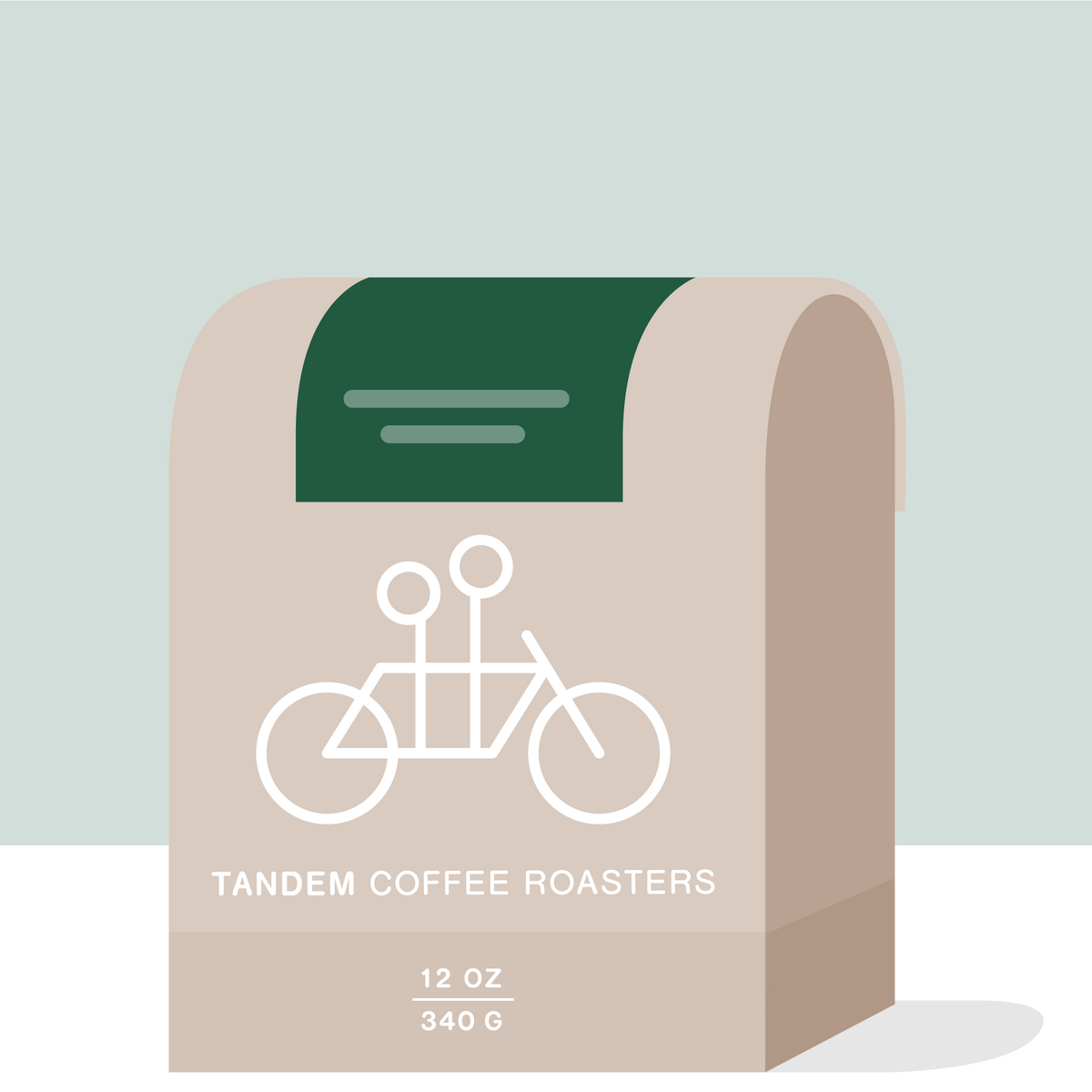 A beige coffee bag with a white tandem bicycle graphic, labeled Tandem Coffee Roasters and 12 oz 340 g, features a dark green tab at the top. This Juan Danilo Florez – Colombia coffee is known for its vibrant tropical fruit notes.